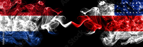 Netherlands vs Brazil, Brazilian, Amazonas smoky mystic flags placed side by side. Thick colored silky abstract smoke flags.