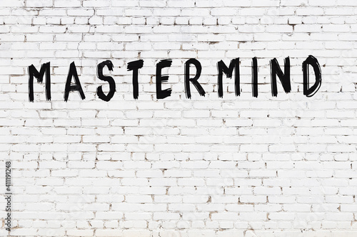 Cuadro en lienzo White wall with black paint inscription mastermind on it