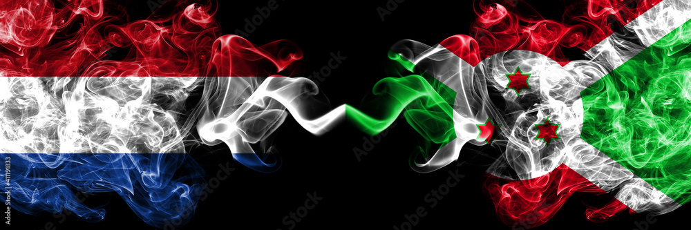 Netherlands vs Burundi, Burundian smoky mystic flags placed side by side. Thick colored silky abstract smoke flags. Netherlands vs Burundi, Burundian smoky mystic flags placed side by side. Thick colored silky abstract smoke flags.