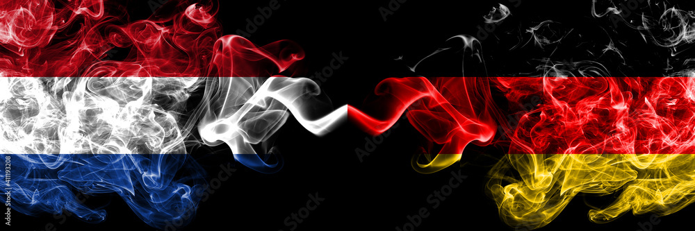 Netherlands vs Germany, German, Deutschland smoky mystic flags placed side by side. Thick colored silky abstract smoke flags.