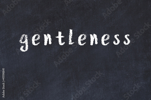 Black chalkboard with inscription gentleness on in