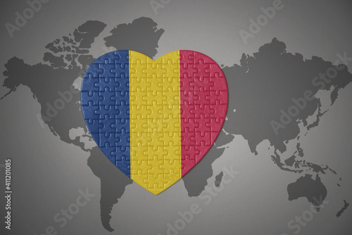 puzzle heart with the national flag of chad on a world map background.