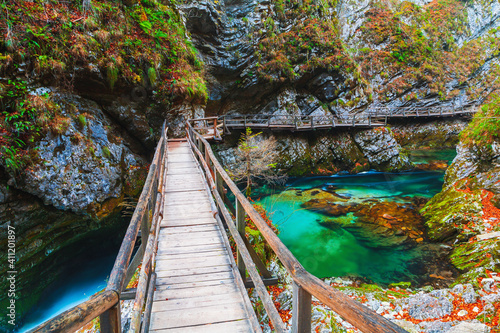 Famous and beloved Vintgar Gorge canyon with wooden path in beautiful autumn colors near Bled Lake of Triglav National Park photo