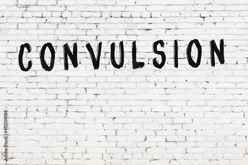 фотографія White wall with black paint inscription convulsion on it