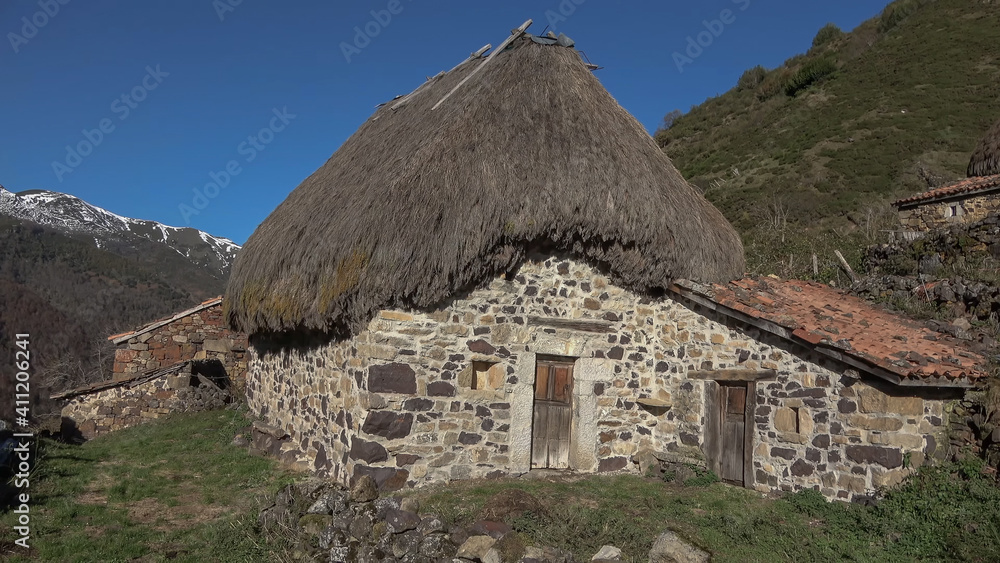 Photograph of a rustic stone country house in a Spanish village