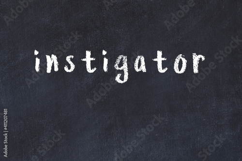 Black chalkboard with inscription instigator on in