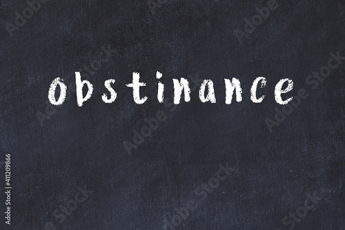 Photos Black chalkboard with inscription obstinance on in