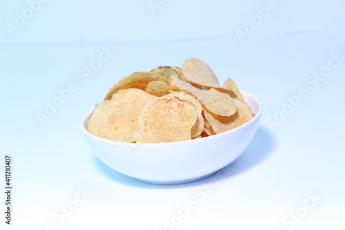 Delicious potato chips, isolated on white background 