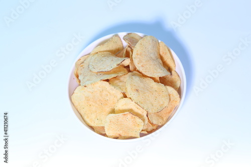 Delicious potato chips, isolated on white background 