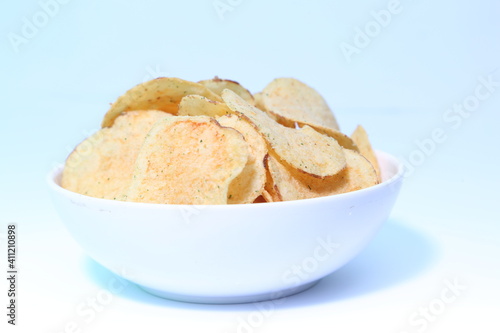 Delicious potato chips, isolated on white background 