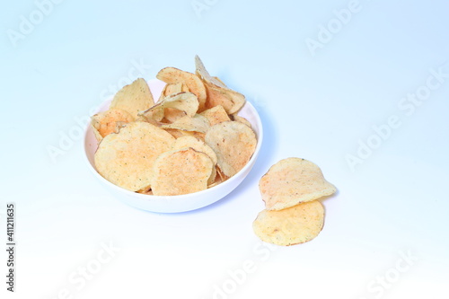 Delicious potato chips, isolated on white background 