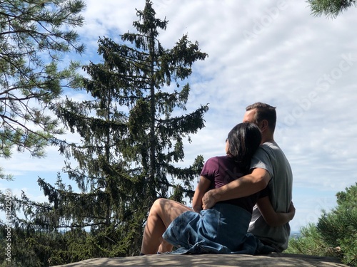 couple sitting on the rocks