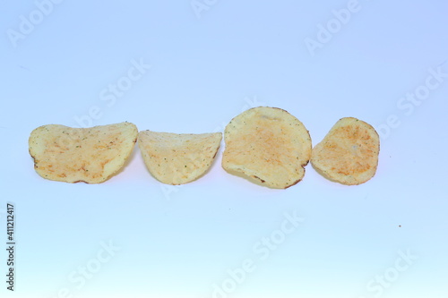 Delicious potato chips, isolated on white background 
