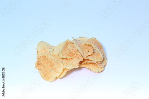 Delicious potato chips, isolated on white background 