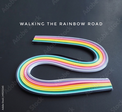 abstract colorful background with word walking in the rainbow road idiom 