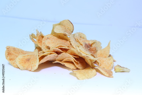 Delicious potato chips, isolated on white background 