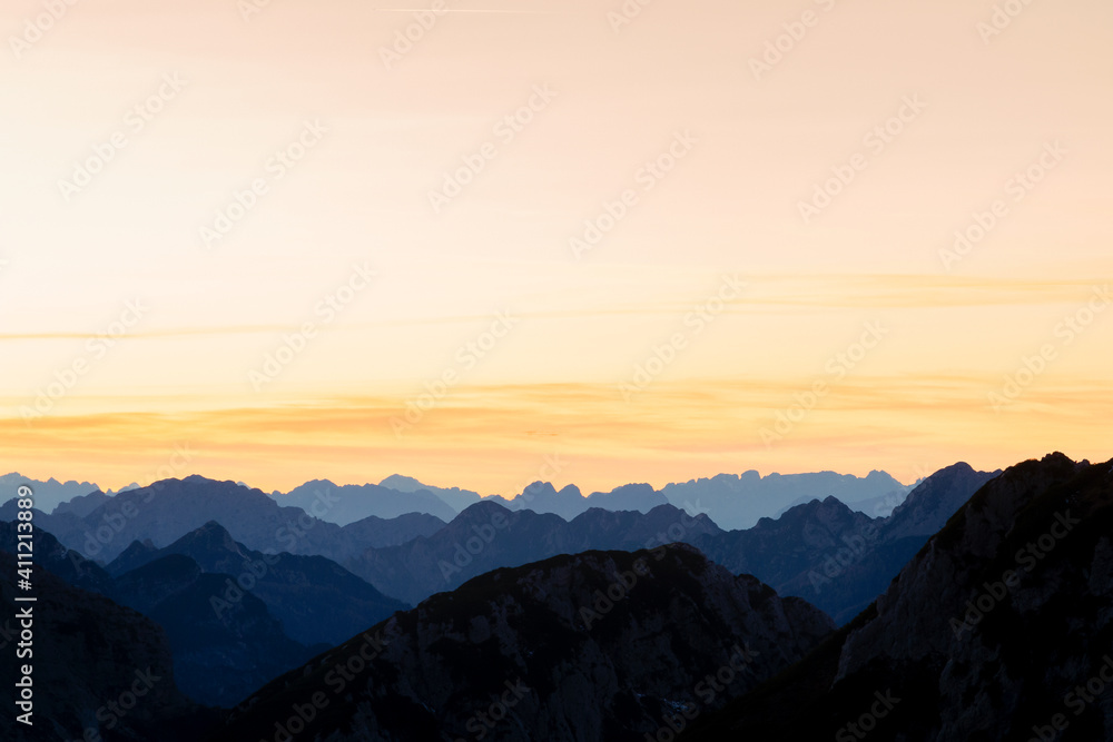 Beautiful view of the Mangart mountains at sunset, in the background from the beautiful peak