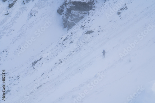 Man hiking in the carpathians mountains with snow