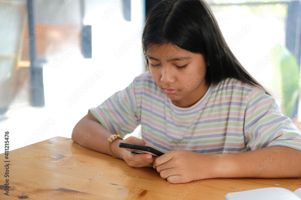 girl student using social media online app on smart mobile phone in library girl student using social media online app on smart mobile phone in library