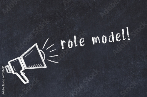Fotografi Chalk loudspeaker and inscription role model on black chalkboard