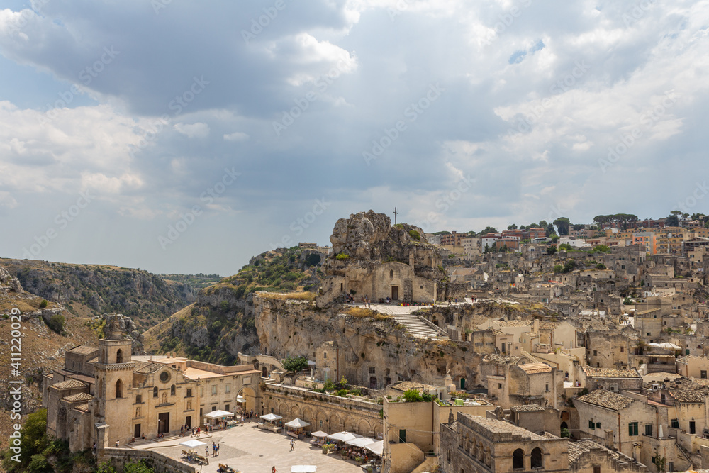 Young woman tourist traveling in Italy to Matera ancient city, An UNESCO site
