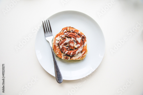 Cinnamon rolls buns on a white plate simple background  photo