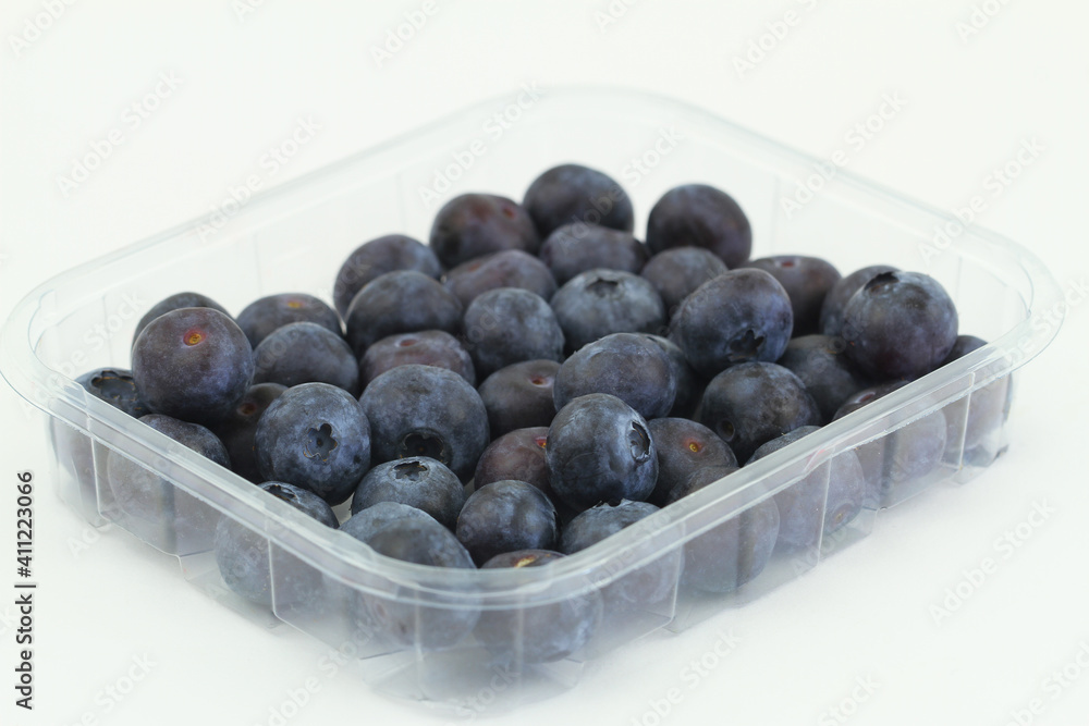 Fresh sweet blueberries in transparent plastic box on white background
Fresh sweet blueberries in transparent plastic box on white background