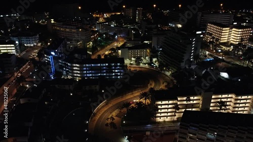 Night shot of Avenida Alfereces Provisionales, curvy street of Playa del Ingles leading to the main entrance to the beach. Gran Canaria