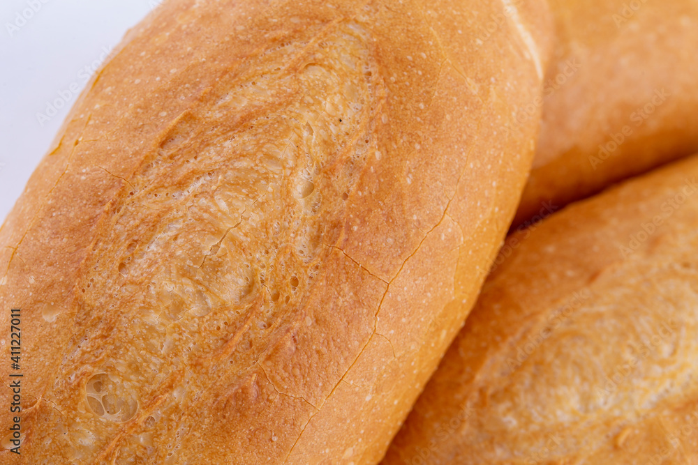 French bread isolated on white background. Fresh and crispy French bread isolated on white background. Fresh and crispy
