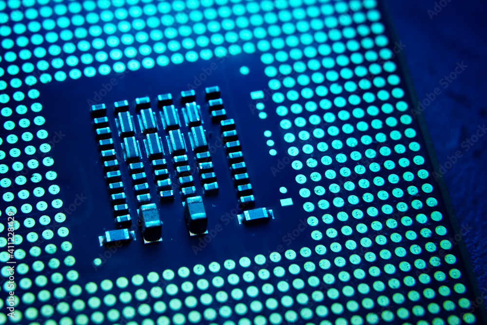 Tech innovation concept background. Close-up of CPU Chip Computer Processor in the lab with blue dramatic toned. Selective Focus. Tech innovation concept background. Close-up of CPU Chip Computer Processor in the lab with blue dramatic toned. Selective Focus.