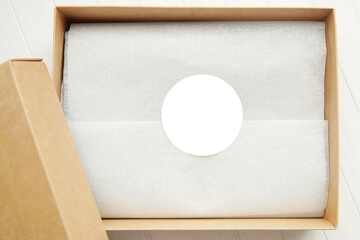 Round sticker mockup for gift, product label mockup, circle gift tag, thank you sticker on kraft paper box.
