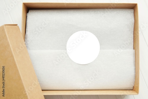 Round sticker mockup for gift, product label mockup, circle gift tag, thank you sticker on kraft paper box.
