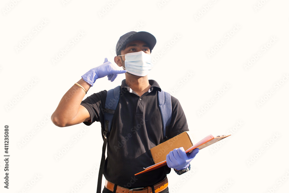 delivery man holding box and making call me gesture delivery man holding box and making call me gesture