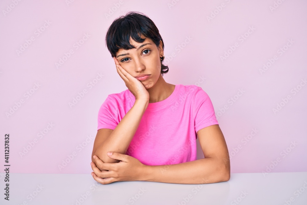 Beautiful brunettte woman wearing casual clothes over pink background thinking looking tired and bored with depression problems with crossed arms. Beautiful brunettte woman wearing casual clothes over pink background thinking looking tired and bored with depression problems with crossed arms.