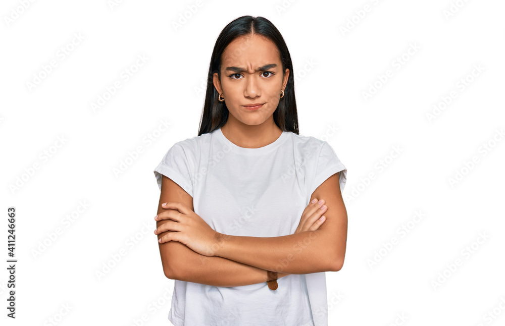 Young asian woman wearing casual white t shirt skeptic and nervous, disapproving expression on face with crossed arms. negative person. Young asian woman wearing casual white t shirt skeptic and nervous, disapproving expression on face with crossed arms. negative person.