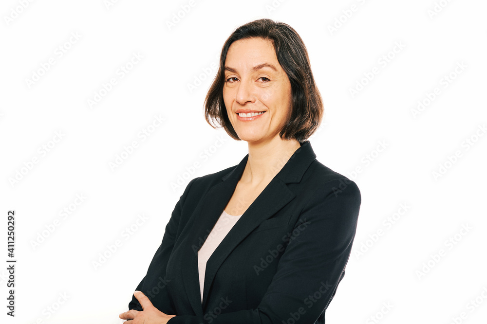 Studio portrait of 45 - 50 year old woman posing on white background, wearing black jacket Studio portrait of 45 - 50 year old woman posing on white background, wearing black jacket