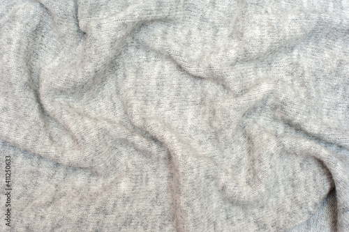 Knitted gray background. Textures for wallpapers and backgrounds. 