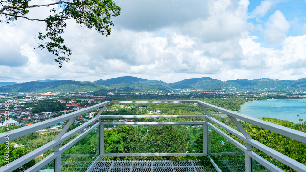 Fototapeta premium Terrace over looking view with a beautiful landscape scenery view of Tropical sea and mountain blue sky white clouds in Phuket Thailand