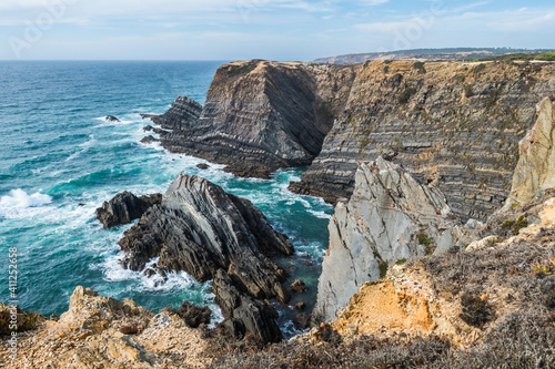 Cliffs with steep rocks in turquoise seascape, Vicentine Coast Natural Park - Cabo Sardão PORTUGAL