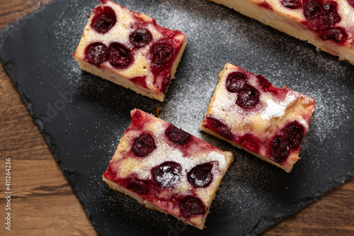 Sliced homemade apple and cherry cake