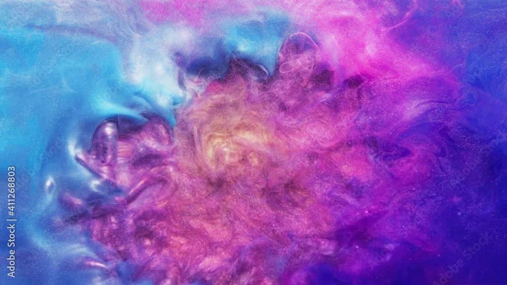 Paint splash. Color blast in water. Hot cold fluid mix reaction. Vibrant magenta pink blue orange glitter dye pigment fume cloud spreading motion abstract art background. Paint splash. Color blast in water. Hot cold fluid mix reaction. Vibrant magenta pink blue orange glitter dye pigment fume cloud spreading motion abstract art background.