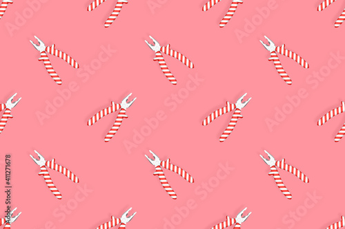 Pliers seamless pattern. Metal pliers with rubber striped grips. Background made of tools. 