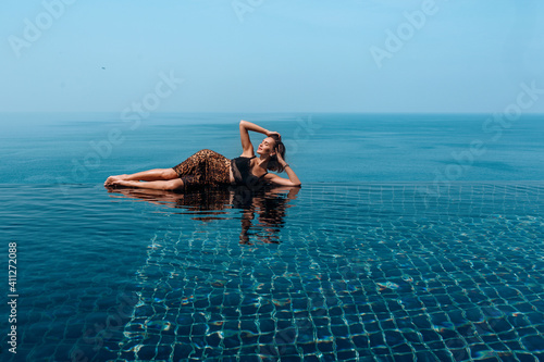 beautiful girl on infinity pool