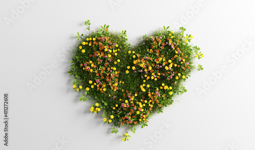 Fototapeta Naklejka Na Ścianę i Meble -  Green grass with spring summer flowers in heart shape