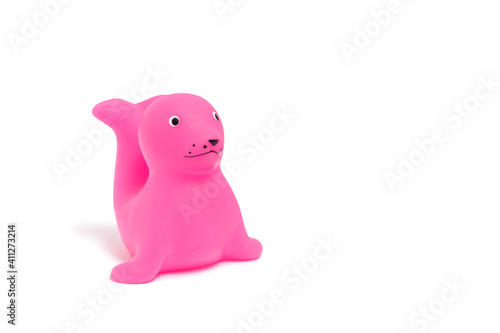 cute pink fur seal - rubber bathing toy isolated on white background