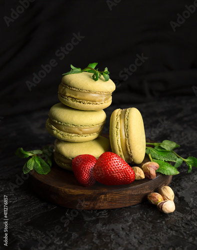 Pistachio macaroni. Small French cakes. Sweet and colorful French macarons cakes.