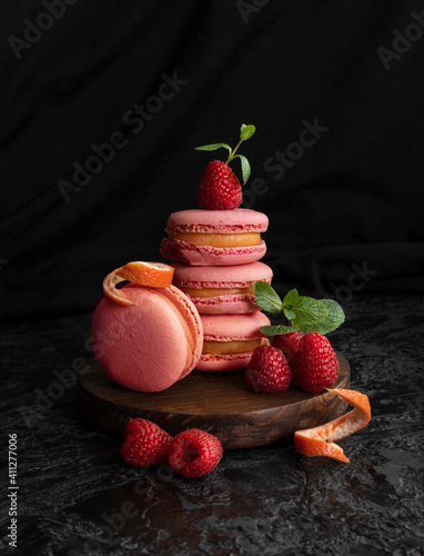 Raspberry macarons. Small French cakes. Sweet and colorful French macarons cakes. Copy Space