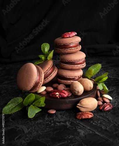 Chocolate macarons. Small French cakes. Sweet and colorful French macarons cakes. Copy Space
