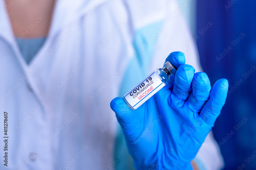 Doctor, nurse, scientist hand in blue gloves holding flu, measles, coronavirus, covid-19 vaccine disease preparing for child, baby, adult, man and woman vaccination shot, medicine and drug concept Doctor, nurse, scientist hand in blue gloves holding flu, measles, coronavirus, covid-19 vaccine disease preparing for child, baby, adult, man and woman vaccination shot, medicine and drug concept