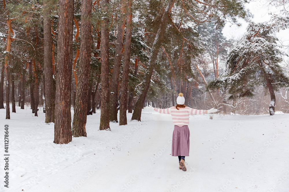 girl in winter forest with snow
